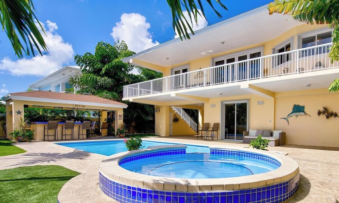 Twin Lakes House | Luxury Water Front Home, Private Pool, Spa, Tiki Bar, 36' Foot Dock with Kayaks