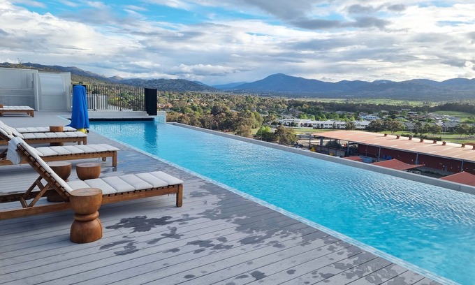 Greenway Apartment | Modern designer gem with access to complex pool, spa, sauna and rooftop park.