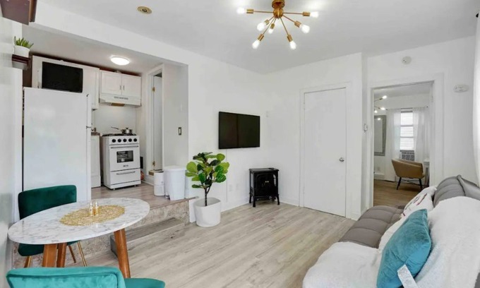 Prospect Park Apartment | Modern, Quiet Apt 30 min to NYC with Workspace, Private Patio & Parking.
