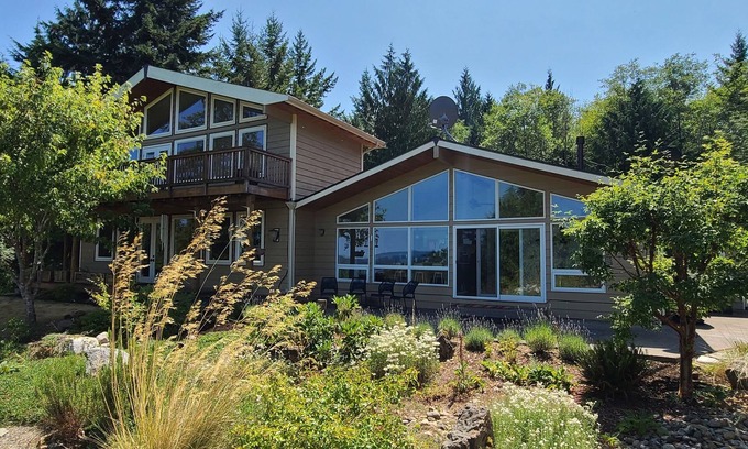 Hamma Hamma House | Modern retreat with serene canal, forest, and mountain views.
