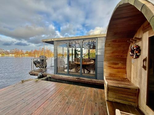 Baambrugse Zuwe Boat Rental | NEW - Little Asia - Stunning Boathouse on a lake Near Amsterdam with Sauna