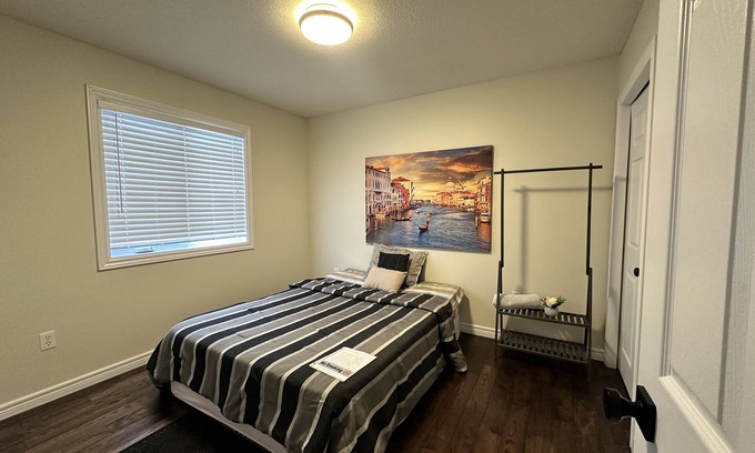 Grand River South House | Nice home with cozy living room, large backyard, bedroom and bathroom.