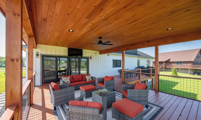 Waterfront Greens House | Night & Day: Lake Access, Hot Tub!