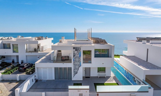 Salema Villa | Ocean Front Algarve. Chic, modern villa with two pools in quaint fishing village
