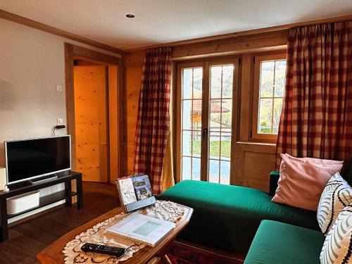 Zweisimmen House | One Bedroom with mountain and garden view ground floor of Chalet Solaria