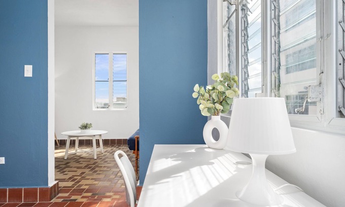 Sagrado Corazon Apartment | Otium Rentals Plush King Bed Pacman Arcade