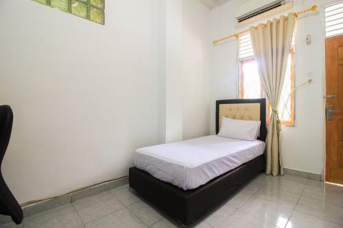 Pekanbaru Hotel | OYO Life 2553 Kost Daya