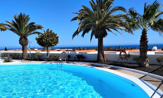 Puerto del Carmen Apartment | Panoramic sea views, sunny, private balcony, new kitchen & bathroom 2020