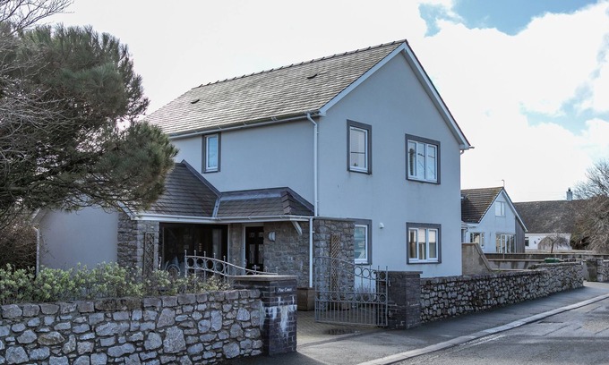 Rhoscolyn House | PINE CONES, with a garden in Four Mile Bridge