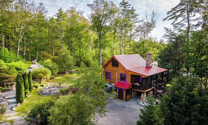 Yulan House | Private log cabin nestled at the base of a secluded wooded area n
