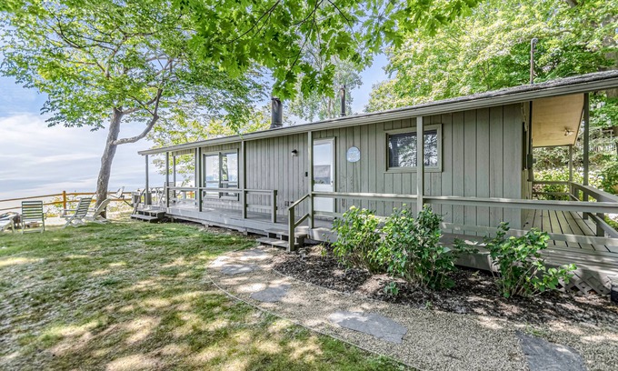 Fennville Cottage | Quaint lakefront cottage w/private hot tub, firepit, & beautiful sunset views