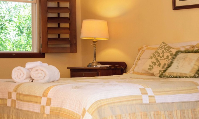 Orchid Bay Bed & Breakfast | Queen-size bed, with a private bathroom, a walk-in shower and closet.