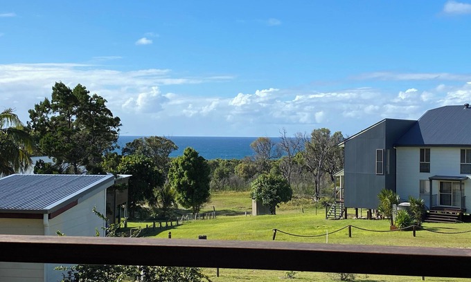Orchid Beach House | Ques R & R at Orchid Beach. Water views with sea breeze. Relaxing Holiday House.