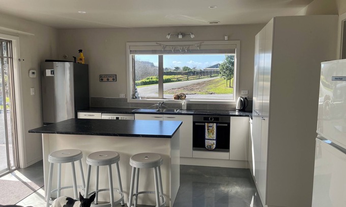 Kawhia House | Quiet private bush out look but right in town. Perfect for boaties