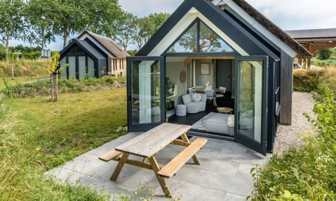 Westenschouwen House | Relax in this chalet, experience the spaciousness from the sofa, from the ridge beam to the surround