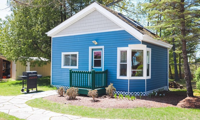 Wasaga Beach Apartment | River View cozy studio cottage with loft, steps shared pool, beach, & firepit