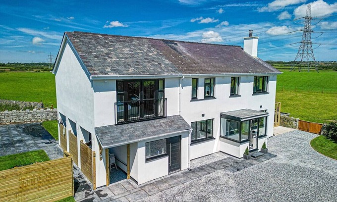 Llangefni House | Rural Hideaway with Hot Tub, Orchard & Games Room