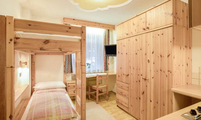 Colfosco Apartment | Rustic Apartment near Ski Areas with Wi-Fi, Garden and Terrace