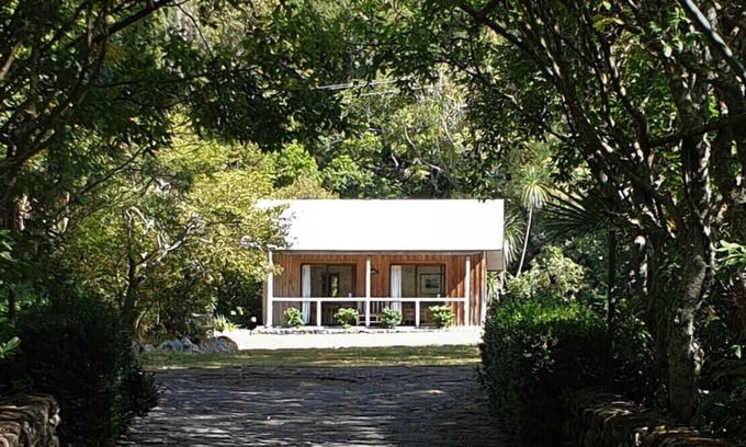 Western Lake Cabin | Rustic cabin & large kitchen block nestled in a native garden.