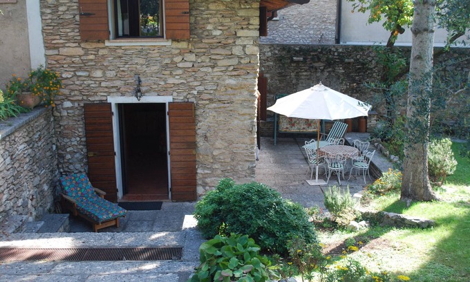 Cecina Apartment | Rustico Cecina by Theater Home, with big closed garden