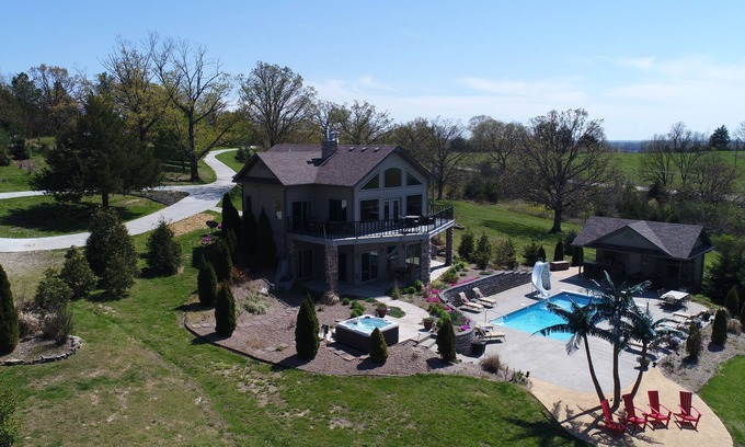 Belle House | Scenic Lakeside Chateau with Heated Pool, Hot Tub & Outdoor Kitchen-TV-Fireplace