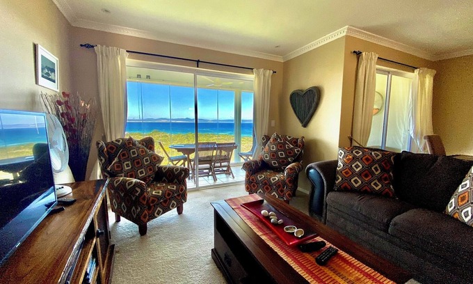 Hermanus City-Centre Apartment | Seafront @ Marine Terrace - views of Walker Bay. Whales, waves and sunrise