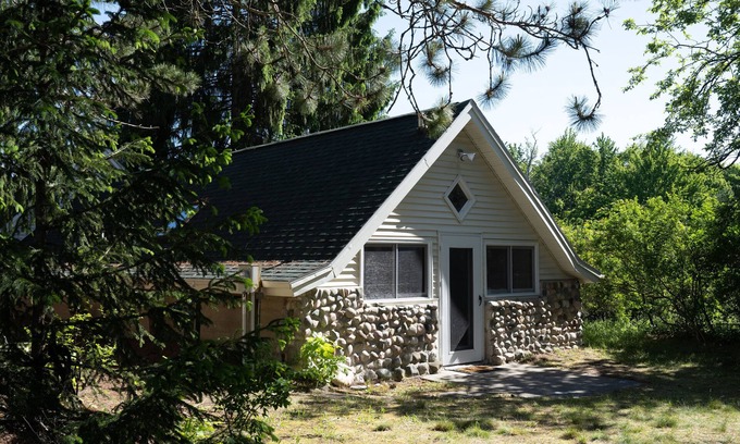 Burt Lake Cottage | Secluded hideaway in the woods! Renovated, well appointed 1928 cottage