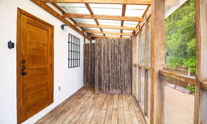 Dangriga Cabin | Secluded seaside cabana with beach access, ocean view, hammock & partial AC