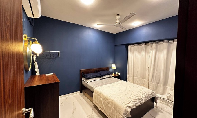 Goregaon West Apartment | Sky Oasis: Premium 2BHK I 65' TV, AC, High Floor, Andheri West