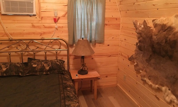 Hugo House | Small one room cabins with no bathrooms hot tub and covered picnic tables.