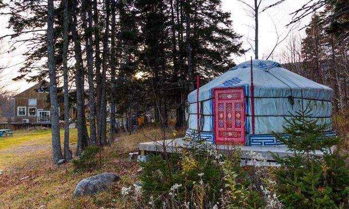Indian Brook Resort | Small red yurt at Cabot Shores Wilderness Resort