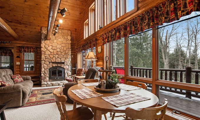 Presque Isle Cabin | Spacious and beautiful lakefront log home on 7 acres with private dock