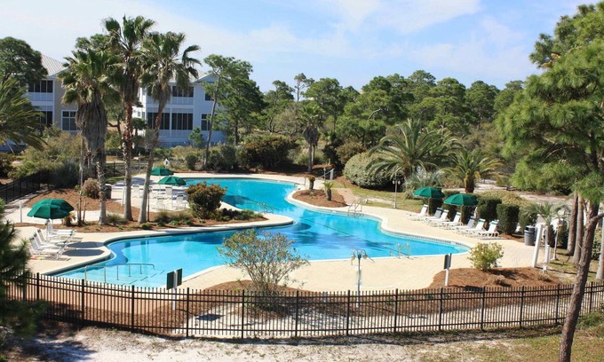 Plantation House | Spacious dog-friendly home with elevator, screened decks, on-site pool, & gym