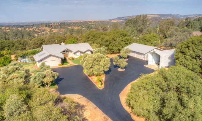 Oroville East House | Spacious residential home with pool, bar, and game room.
