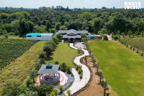 Jabalpur Villa | StayVista at Riverfront Cottage with Scenic River view, BBQ, Bonfire, Gazebo, Pet friendly