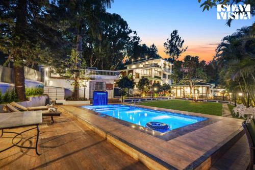 Nandanwan Villa | StayVista's Grace & Light - Hill-view villa with Outdoor pool, Terrace & Games room