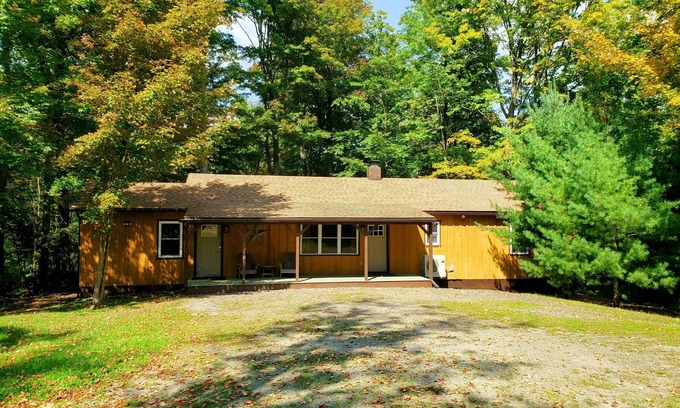 Sabinsville Cabin | Stone fireplace, Kingsize beds,3 baths,3 bdrms,2 creeks,10 acres,covered decks,