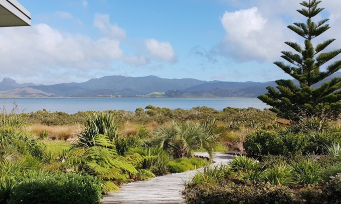 Matarangi House | Stunning modern harbour front beach house.