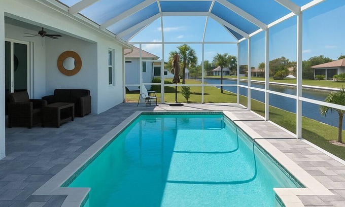 White Marsh House | Stunning Modern New Construction Home w/Pool, Canal Views, & BBQ