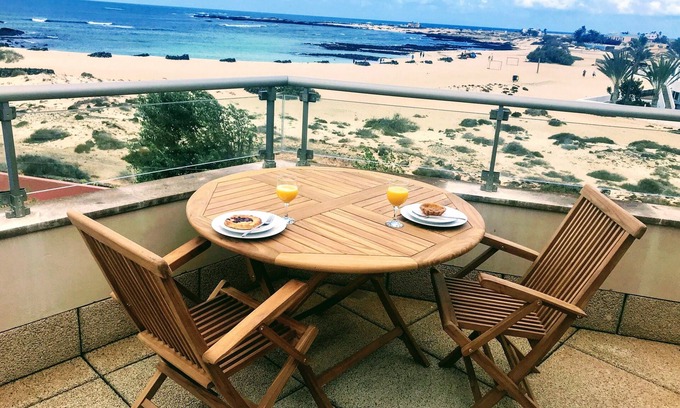 Los Lagos Apartment | Stunning views & location. Spacious 1 bed apartment directly on beach El Cotillo