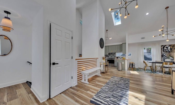 Inman Park Apartment | Stylish 3BR/3BA upper unit in fully remodeled 1920s duplex. Vaulted ceilings, updated kitchen, smart TVs, and private balcony. Perfect for families or groups in walkable Inman Park near BeltLine, dining, and MARTA.