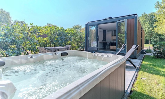 Maasbree House | Stylish two-person forest cabin with jacuzzi, set in nature with comfort, privacy and access to top-tier park facilities.