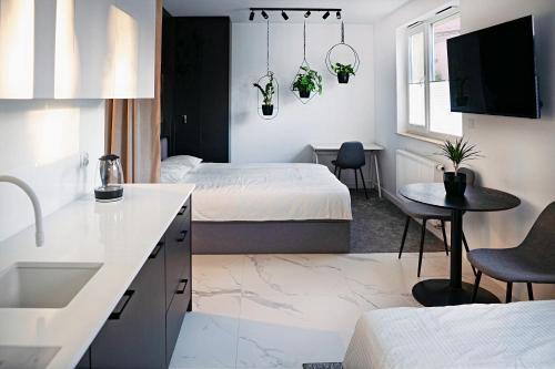 Wola Duchacka Apartment | Stylish Urban Retreat by UR4N!