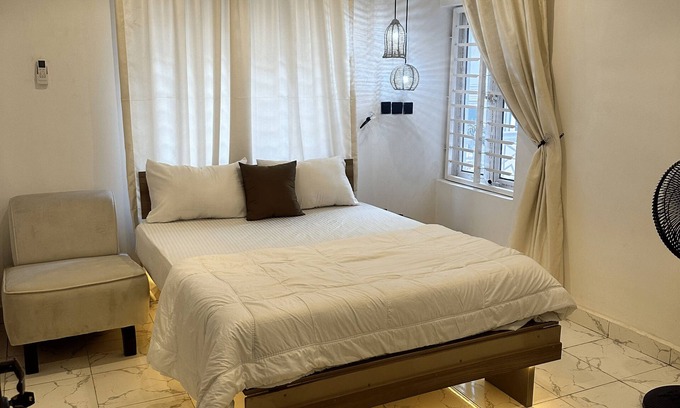 Abuja Apartment | Sunflower themed room in very serene and secure environment in the city center.