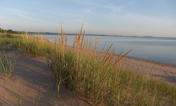 Upper Peninsula Michigan Cottage | Superior Beach House - White sand beach & Lake S just steps from front door!