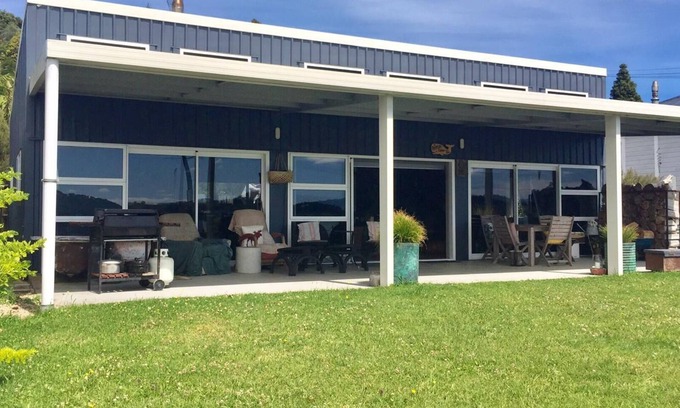 Taharoa House | Te Waitere Village spectacular water views of harbour and surrounding hillsides.