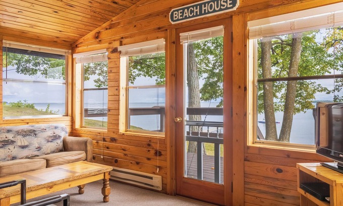 Walker Cabin | The Beach House Leech Lake - King bed &wall of windows just steps from the lake.
