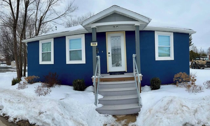 Oconto House | The Blue Riverside Home in Oconto
