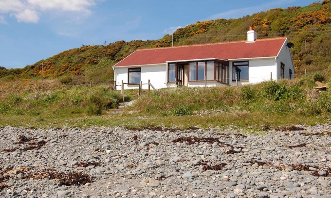 Monreith Cottage | The Haven nestling in an idyllic setting on the shore of Luce Bay in Galloway a
