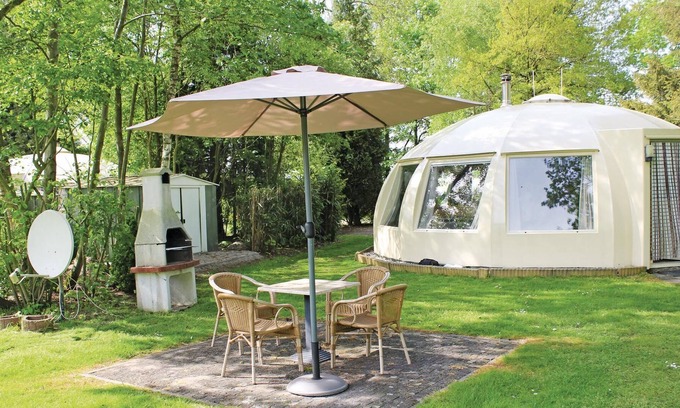 Municipality of Alphen-Chaam House | These detached bungalows with domed roofs are scattered in a wooded resort.